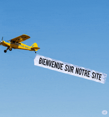 a yellow plane is carrying a banner that reads bienvenue sur notre site