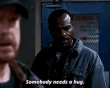 a man in a jacket says somebody needs a hug .