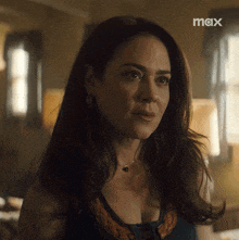 a close up of a woman 's face with the word max on the bottom