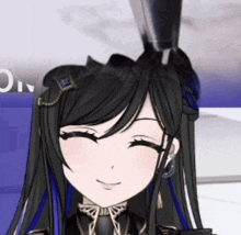 a close up of a girl with long black hair and blue streaks