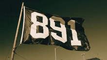 a black and white flag that says 891 on it