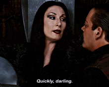 a woman says " quickly darling " while looking at a man