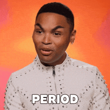 a man in a white studded jacket is saying period