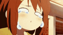 a girl is crying with tears running down her face .