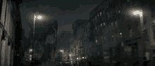 a man in a hat is walking down a dark street at night