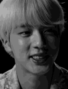 a close up of a person 's face with a smile on their face .