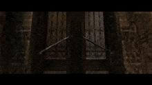a staircase in a dark room with a light shining through the stairs