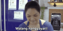 a woman in an apron is smiling and says walang nangyayari