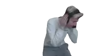 a man wearing headphones is dancing in front of a white background .
