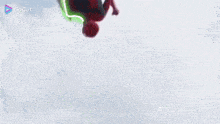 a man is holding a captain america shield in his hand while jumping in the air .