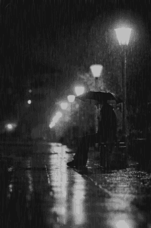 sad rainy night umbrella black and white rain