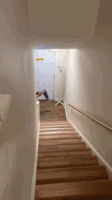 a set of wooden stairs leading up to a doorway