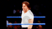 a blurry picture of a man in a boxing ring .