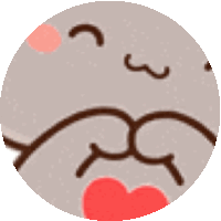 a close up of a cat 's face with a red heart in its mouth .