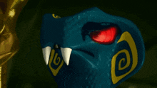 a blue snake with a red eye and a yellow spiral