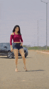 a woman is dancing in front of a car and the words dance com nacao musical are above her