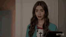Hmm Lily Collins GIF - Hmm Lily Collins Emily Cooper GIFs