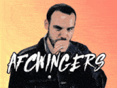 a man in a denim jacket covering his mouth with his hand and the word afcwinger 's written above him