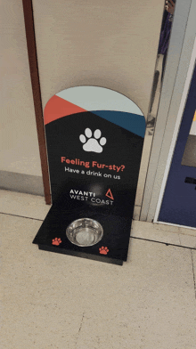 a sign for avanti west coast has a paw print on it