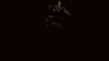a black and white photo of a person in the dark