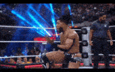a man in a wrestling ring with the letter w on the ropes