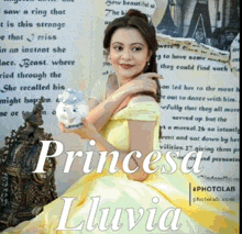 a woman in a yellow dress holding a snow globe with the name princesa lluvia on the bottom