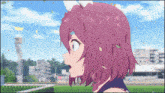a girl with purple hair stands in front of a stadium