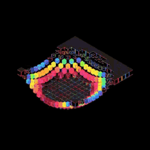 a rainbow of colored cubes on a black surface