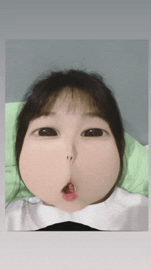 a girl with a very large face and a red lip