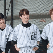 a boy wearing a jersey that says the boy 02