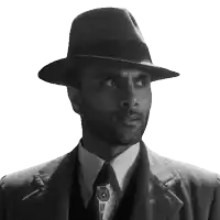 a man with a beard wearing a fedora and suit
