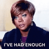 a woman is making a funny face and saying `` i 've had enough ''