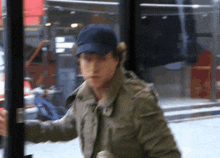 a man wearing a baseball cap and a jacket