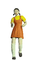 a doll in an orange dress and yellow shirt is flexing her arms
