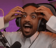 a man wearing headphones with his mouth open