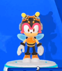 a cartoon character is wearing a bee costume and standing on a blue background .