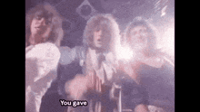 a group of people dancing in a dark room with the words " you gave " written on the bottom