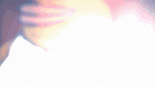 a blurry picture of a person 's face with a white background