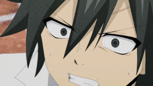 a close up of a person 's face with a surprised look on it