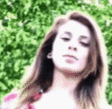 a close up of a woman with her eyes closed