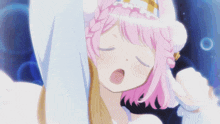 a girl with pink hair has her eyes closed and her fist up