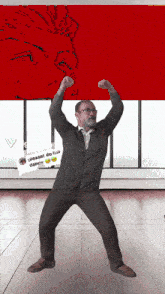 a man is dancing in front of a sign that says please do ha dance