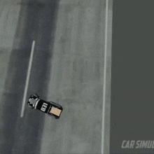 a black car with the letters leb on the side is driving down a road