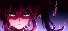 a close up of a girl 's face with green eyes and red hair