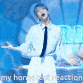 a man in a white shirt and tie is singing into a microphone with the words my honestest reaction written below him .