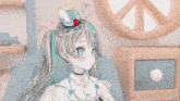 a girl with a strawberry on her head is holding a spoon