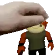 a hand is putting a stuffed animal on top of another stuffed animal