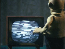 a statue is looking at a television screen with a grid of lines on it