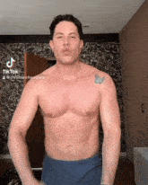 a shirtless man with a tattoo of a butterfly on his shoulder has a tiktok account