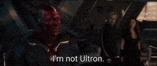 a man with red eyes says i 'm not ultron in a movie scene
